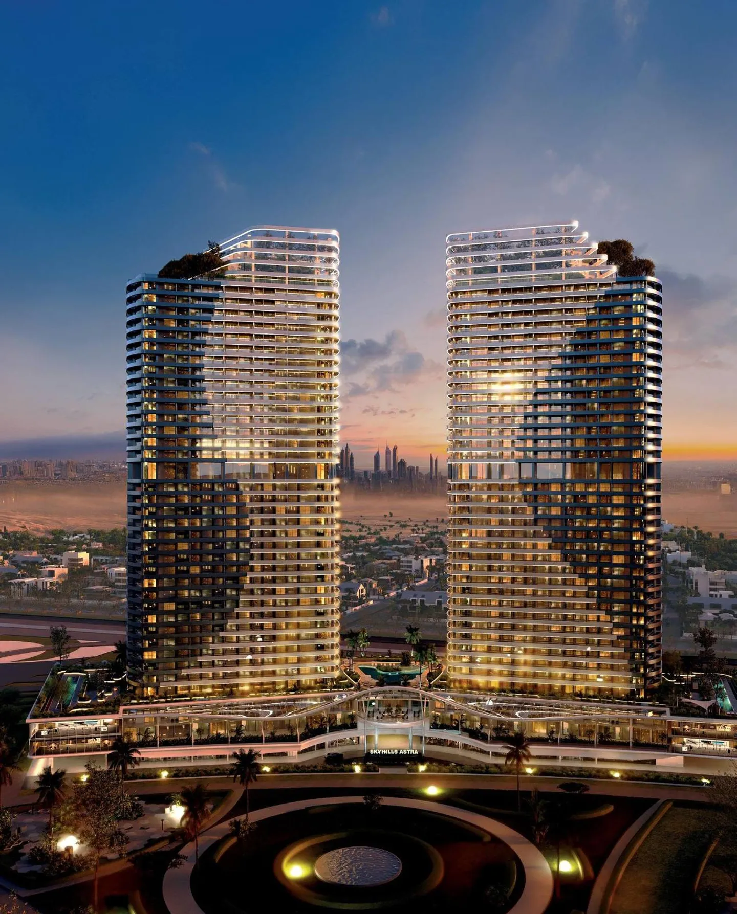 Twin residential towers at dusk, developer render